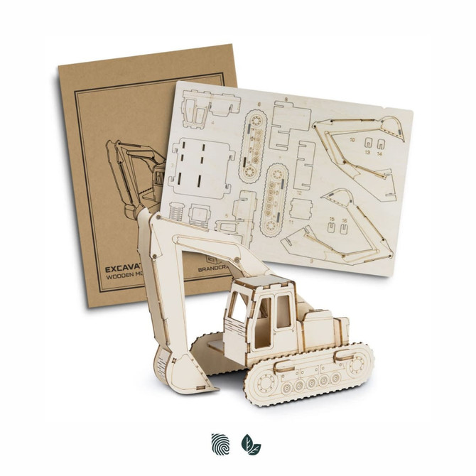 A wooden model of an excavator in natural tones, accompanied by assembly instructions and a branded logo.