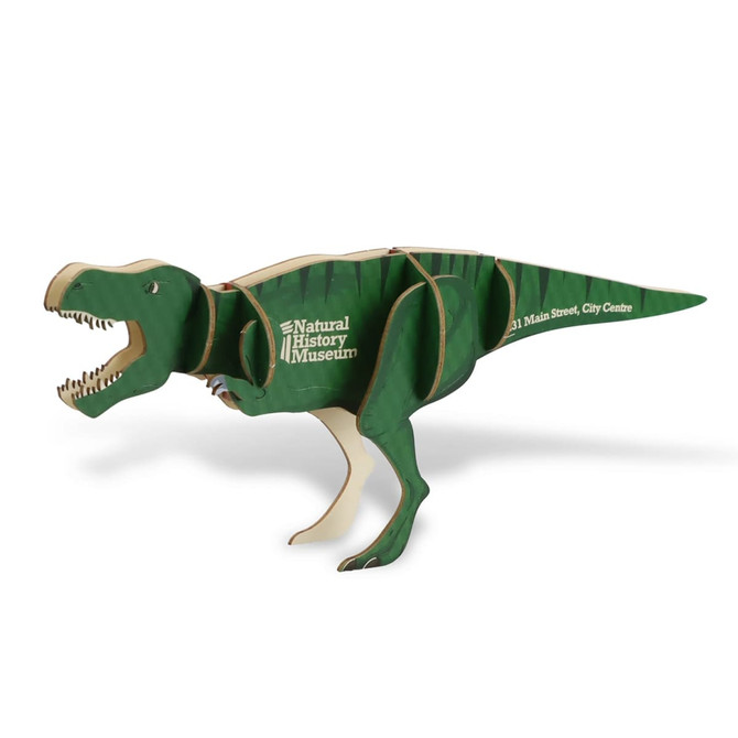 A green Tyrannosaurus Rex wooden model, featuring jointed limbs and a logo, stands in a dynamic pose.