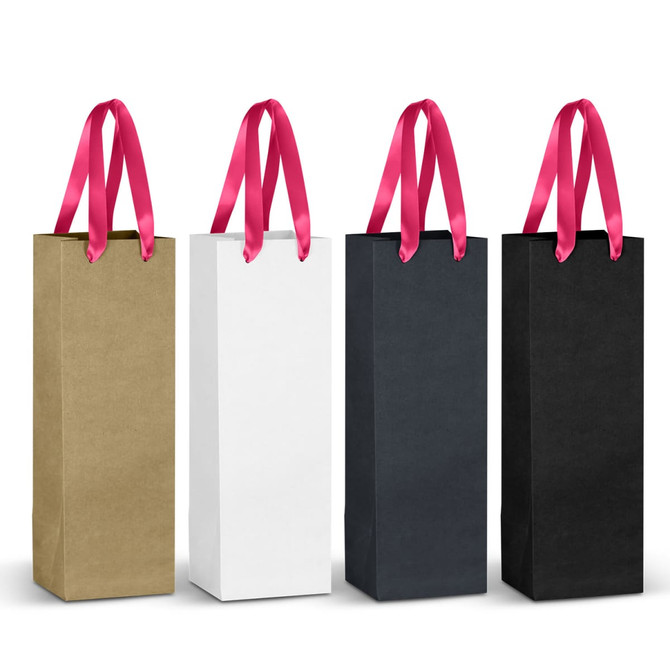 A set of four paper bags in gold, white, navy, and black, each with pink ribbon handles. Each bag has a logo.
