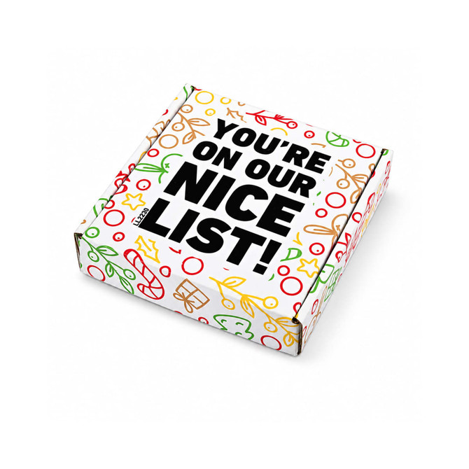 A gift box featuring festive designs in red, green, and gold, with a prominent black text message.