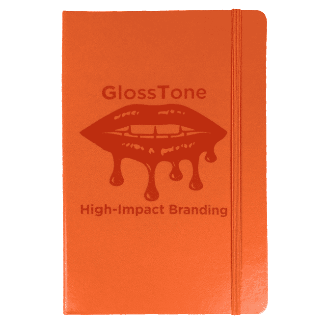 An orange journal with a textured cover and a logo, featuring an elastic band closure.