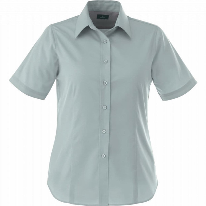 A light green women's short sleeve button-up shirt with a classic collar and a logo on the chest.