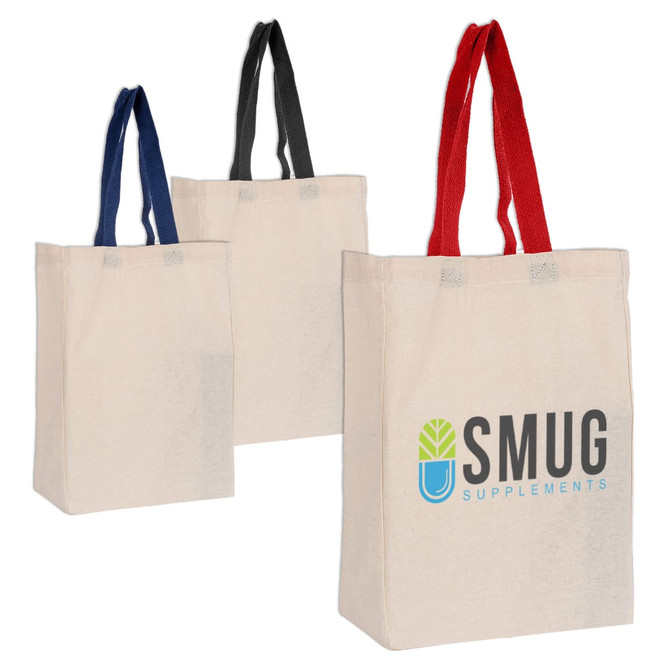 Three Calico trade show bags in natural, with red, black, and navy handles, featuring a logo on one bag.