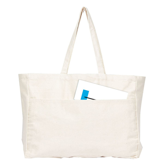 A large cream canvas tote bag with two handles and a front pocket, featuring an item partially tucked inside.