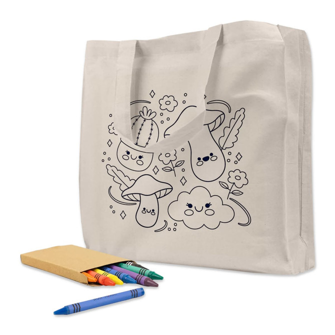 A cream-coloured tote bag featuring black line drawings of happy mushrooms, clouds, and cacti, accompanied by colourful crayons.