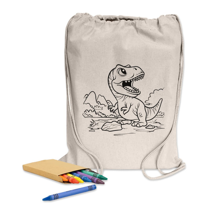 A drawstring library bag in natural colour with a dinosaur design, accompanied by crayons and a notepad.
