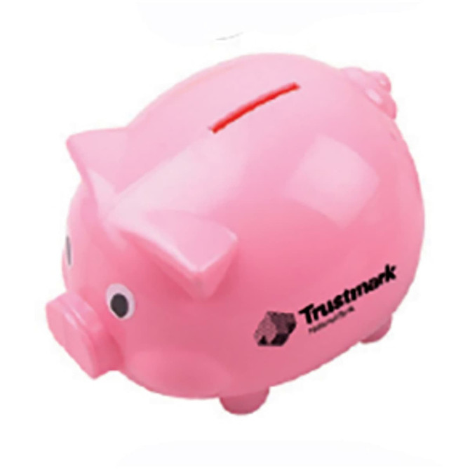 A pink pig-shaped coin bank with a slot for coins and a logo on the side.