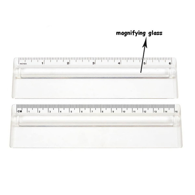 A transparent 15cm ruler featuring a magnifying glass, with clear measurement markings in centimetres and inches.