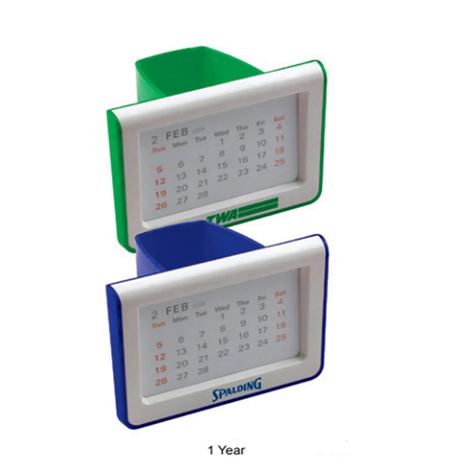 A pen holder with a built-in calendar, featuring green and blue designs, displaying a one-year calendar.