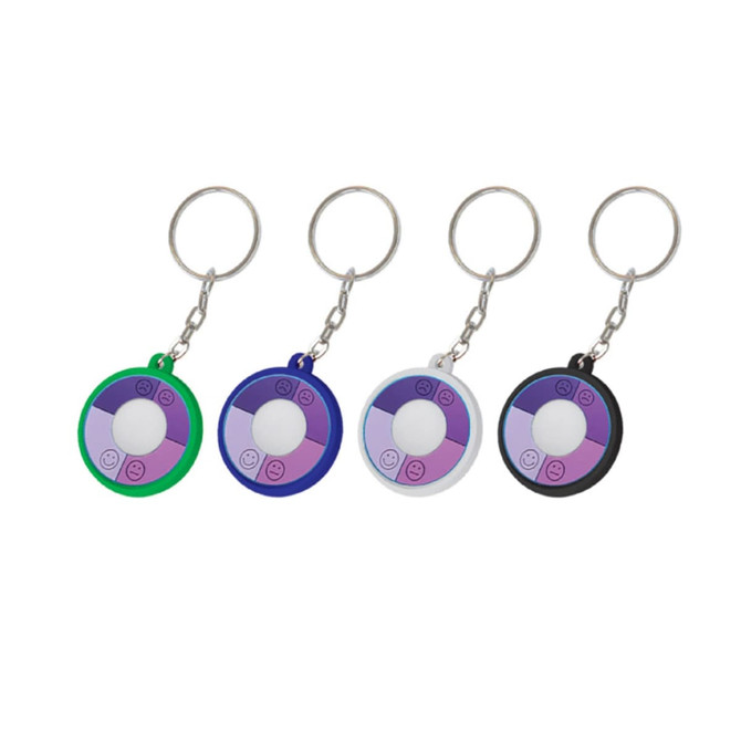 A set of four UV Checkers in green, blue, white, and black, each attached to a keyring.