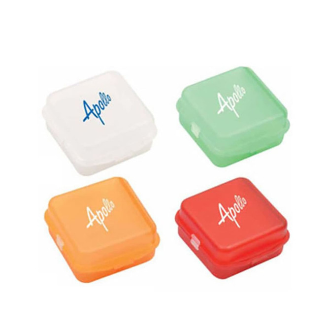 A set of four pill boxes in white, green, orange, and red, featuring a logo on each box.