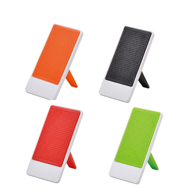 A phone holder with a stand in orange, black, red, and green colours, featuring a textured surface and a logo.