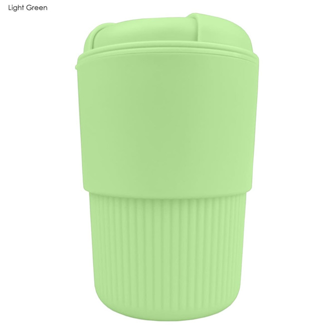 A light green reusable coffee cup with a ribbed silicone sleeve and a secure lid, featuring a logo.