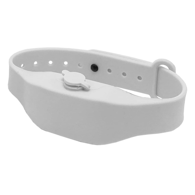 A white wristband hand sanitiser dispenser with an adjustable strap and a small button for dispensing.