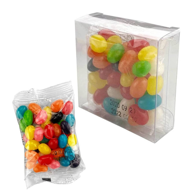 A clear box containing colourful jelly beans, with a smaller plastic bag of jelly beans beside it.