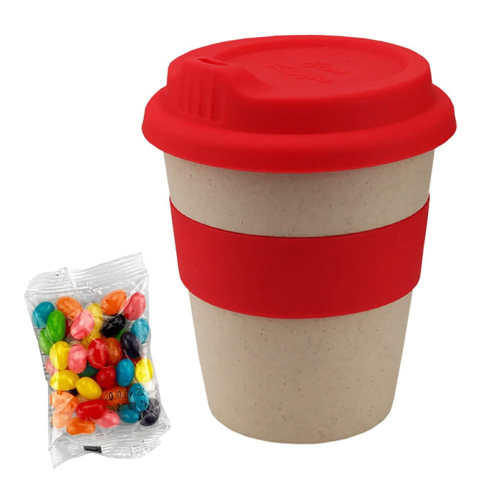 A bamboo cup with a red lid and sleeve, accompanied by a pack of assorted colourful jelly beans.
