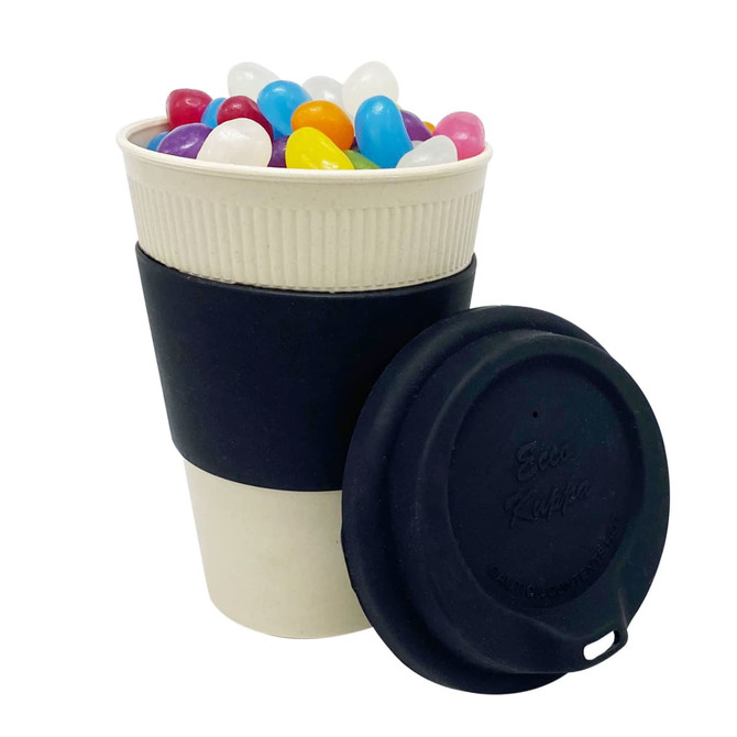 A reusable 12oz bamboo cup with a black lid and sleeve, filled with colourful jelly beans.