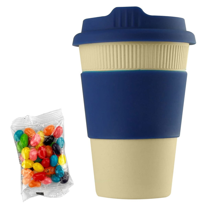 A reusable coffee cup in cream with a navy silicone sleeve, accompanied by a pack of colourful jelly beans.