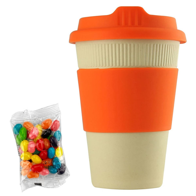 A reusable 12oz bamboo coffee cup in cream and orange, accompanied by a bag of colourful jelly beans.