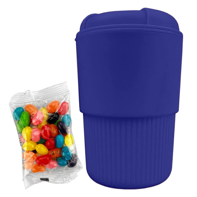 A reusable coffee cup in vibrant purple, accompanied by a pack of assorted jelly beans.