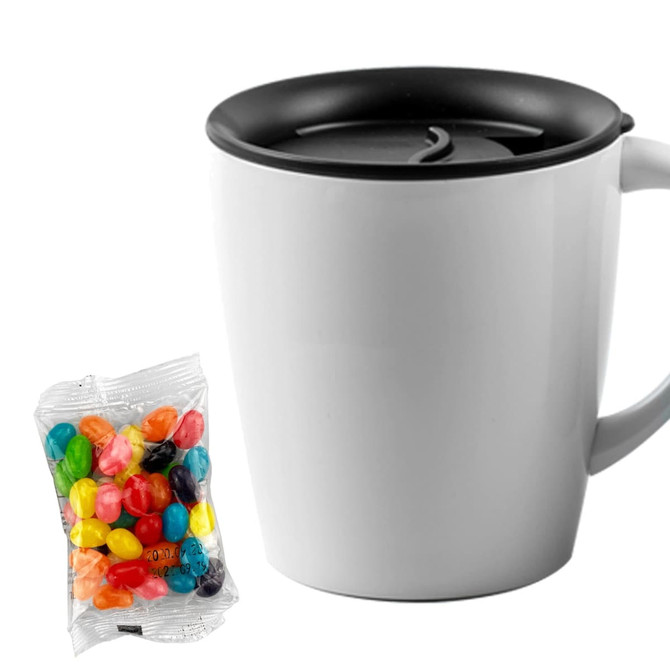 A white mug with a black lid alongside a pack of colourful jelly beans. The mug features a logo.