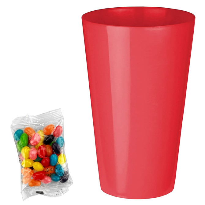 A red party cup next to a packet of colourful jelly beans featuring various shades and patterns.