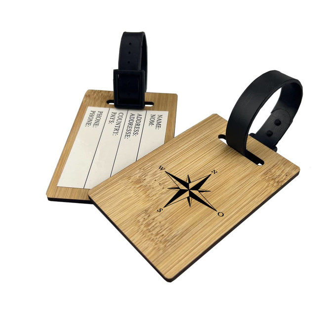 A bamboo luggage tag with a compass design and a black strap, featuring blank areas for personal information.