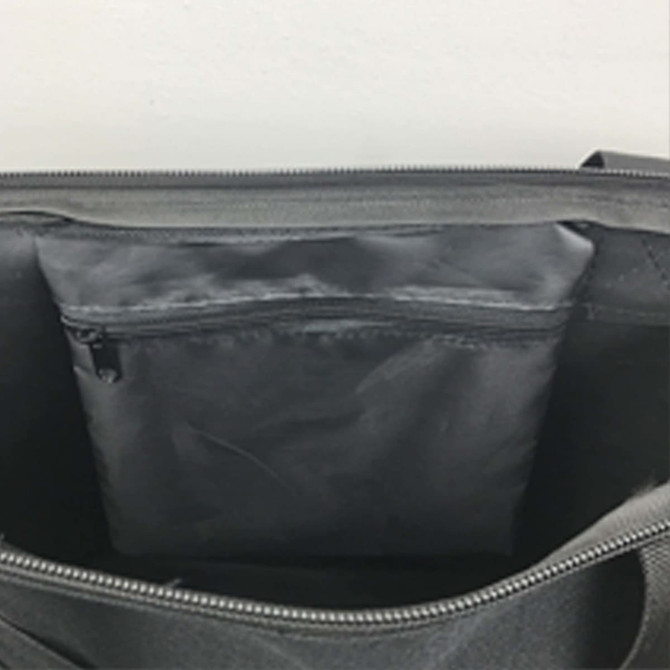 A grey nylon tote bag with a zipped interior pocket and a spacious main compartment.