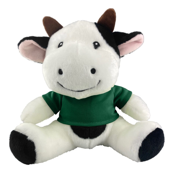 A plush cow toy featuring black and white fur with a green shirt, smiling with ear and horn details.