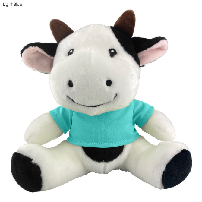 A cute black and white cow plush toy wearing a light blue shirt, featuring a friendly smile and soft features.