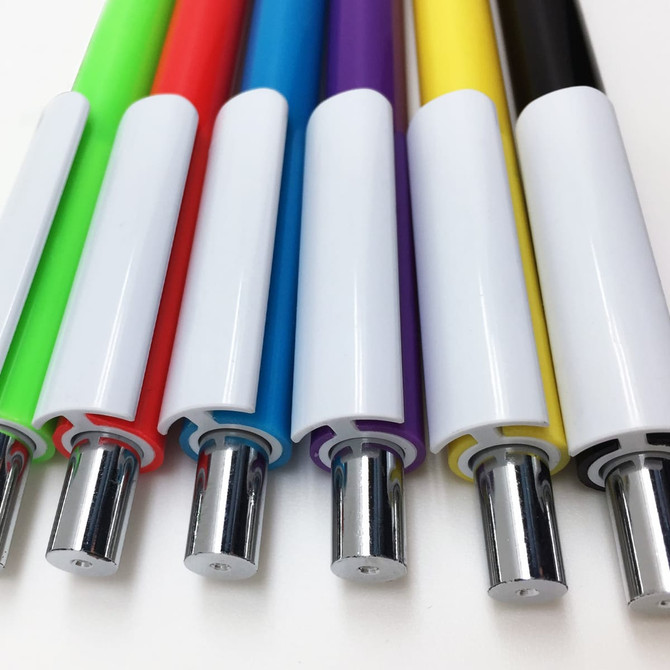 A collection of plastic pens in green, red, blue, purple, yellow, and black, featuring chrome accents and a logo.