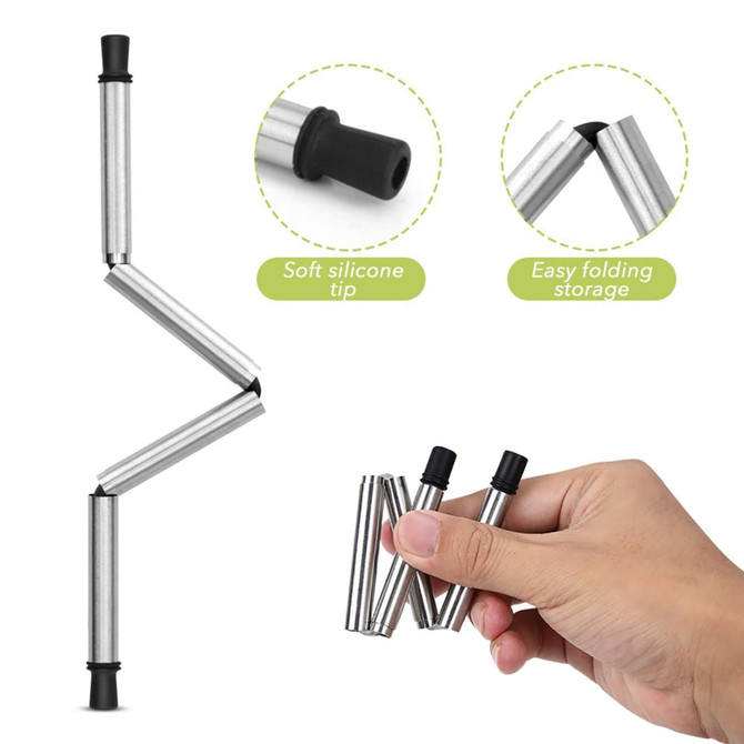 A foldable metal straw in silver with a soft silicone tip, featuring easy folding for storage. There is a hand holding the straw.