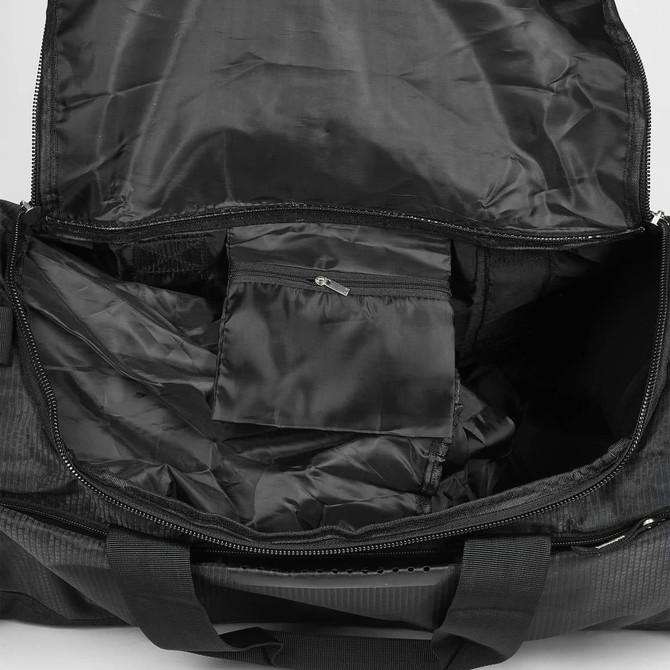 A black duffle bag interior with a zipped pocket and spacious main compartment. It features a logo.