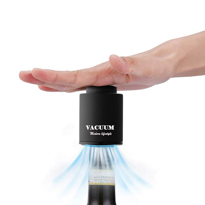 A wine stopper in black with a hand placed on top, designed to create a vacuum seal for bottles.