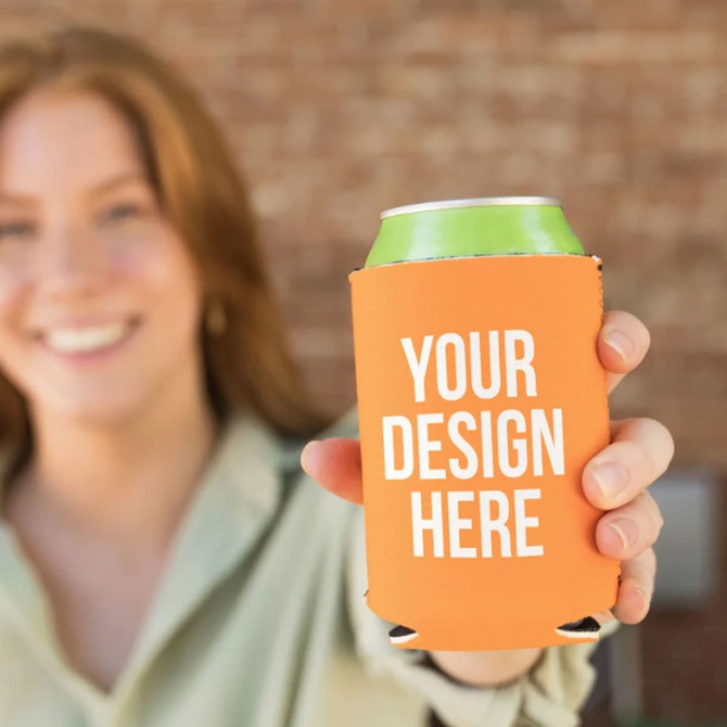 A drink bottle holder in orange, featuring a branding area, presented by a person.