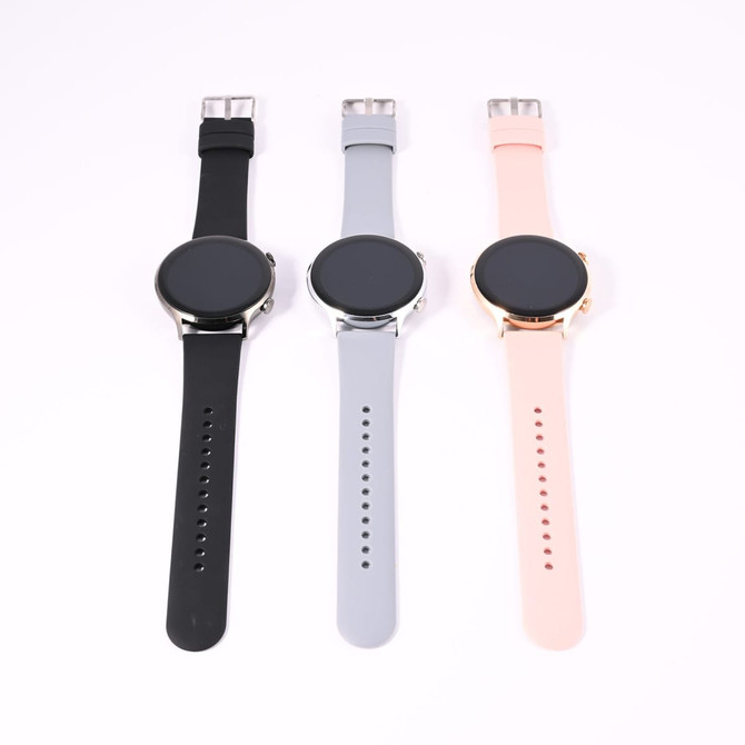 A set of three smartwatches featuring black, gray, and pink straps, each with a round black screen and a metallic casing.