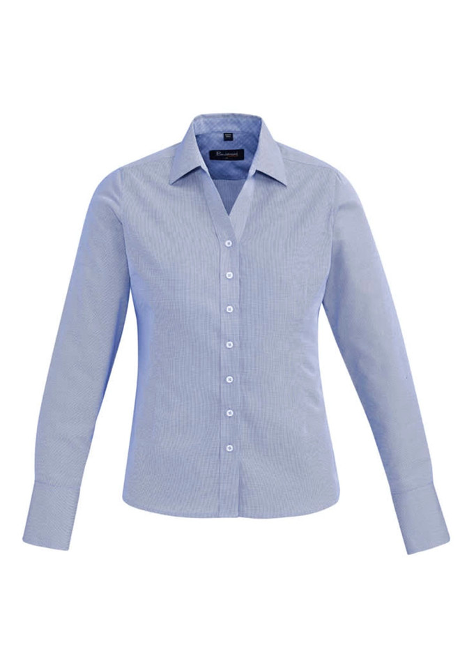 A light blue women's button-up shirt with long sleeves and a collared neckline, featuring a logo.