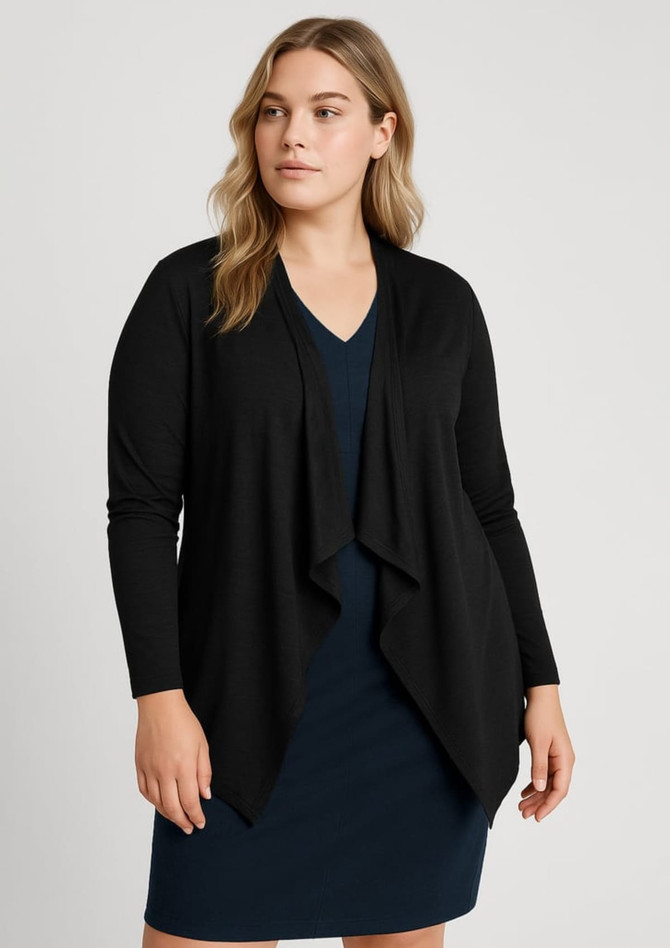 A black women's cardigan with a waterfall front, worn over a navy dress. The model has long, wavy hair.