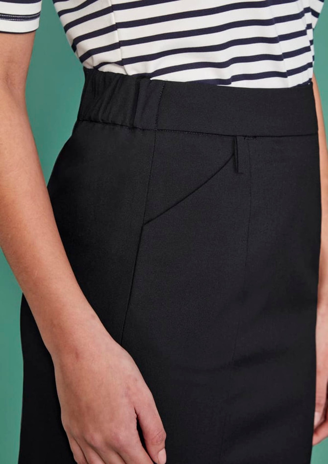 A close-up of a women's functional pencil skirt in black, featuring a smooth finish and elastic waistband.