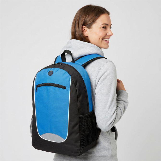 A blue and black backpack is worn by a person, featuring a front pocket and mesh side pockets.