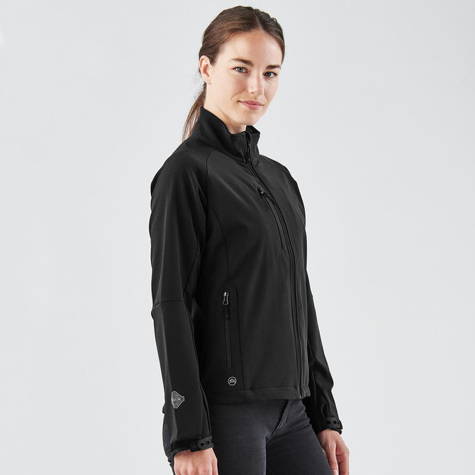 A black women's ultra-light shell jacket with a zip front and two side pockets. It features a logo on the sleeve.
