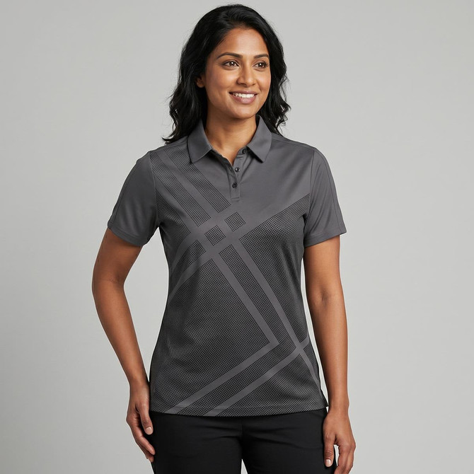 A women's polo shirt in grey with a geometric pattern and a collar. It features a logo on the chest area.