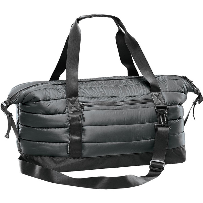 A quilted duffle bag in dark green, featuring adjustable straps and a zippered pocket. It has a logo on it.