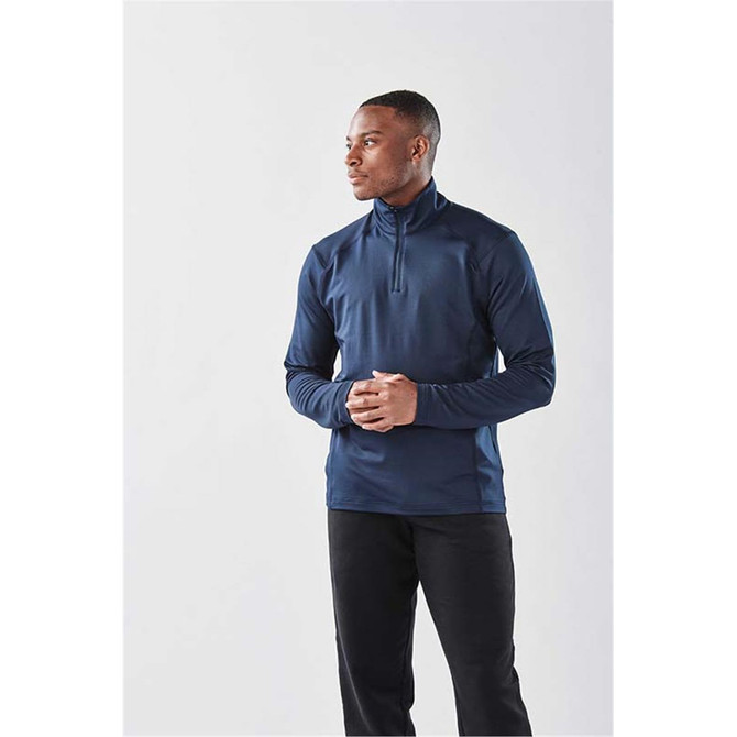 A long sleeve, navy blue quarter-zip shirt with a sleek design and fitted silhouette, featuring a logo.