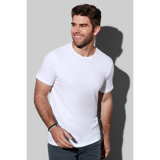 A white men's cotton T-shirt displayed on a model against a grey background. The shirt features a crew neck and short sleeves.