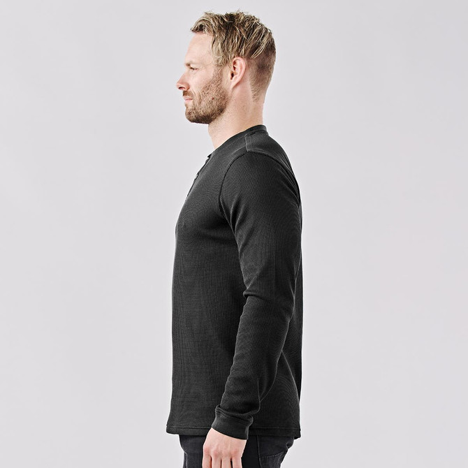 A side view of a men's long-sleeve Henley shirt in black, featuring a collar and a logo.