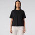 A black T-shirt with short sleeves and a relaxed fit, displayed on a model against a neutral background.