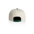 A two-tone cap in cream and green, featuring a green snapback adjustable closure and a logo on the back.