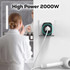A travel adaptor in black and white, designed for high power, plugged into a wall socket.