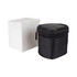 A black travel adaptor case with a textured finish, next to a plain white box.